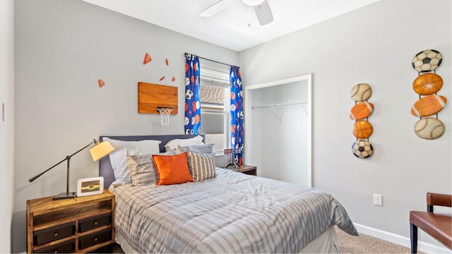 carpeted bedroom featuring a closet, baseboards, and a ceiling fan