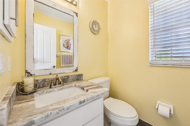 half bath with toilet and vanity