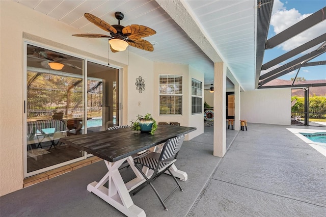 view of patio / terrace featuring glass enclosure, an outdoor pool, and ceiling fan