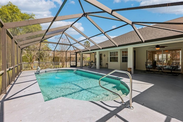 pool with a lanai, a ceiling fan, and a patio