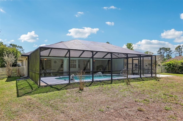 back of house featuring a yard, fence, and a fenced in pool