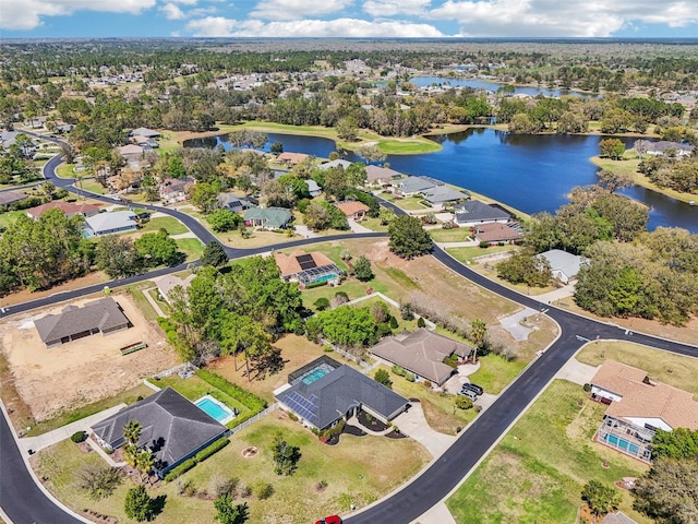 birds eye view of property featuring a residential view and a water view