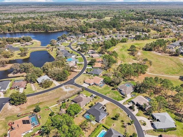 birds eye view of property with a residential view and a water view