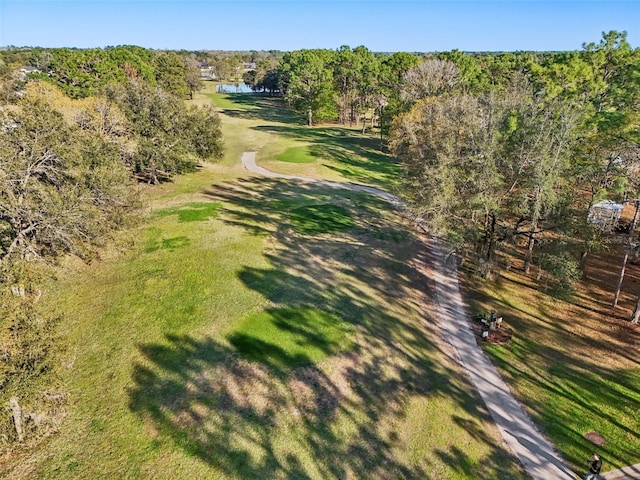 birds eye view of property with a wooded view