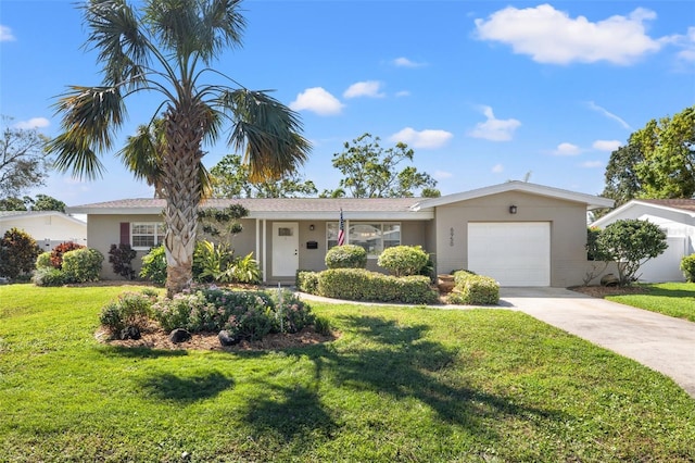 single story home featuring concrete driveway, a front lawn, a garage, and stucco siding