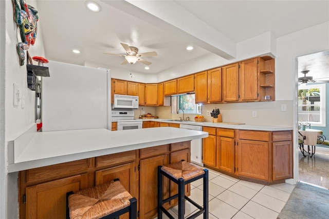 kitchen featuring open shelves, white appliances, a peninsula, light countertops, and ceiling fan