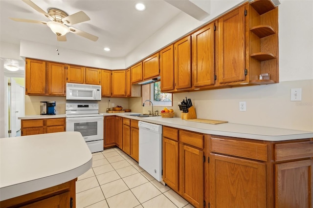 kitchen with white appliances, light countertops, open shelves, and a sink