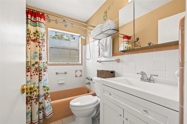 full bath featuring vanity, shower / tub combo, tile walls, toilet, and tile patterned floors