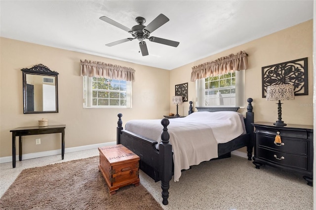 bedroom featuring speckled floor, baseboards, and ceiling fan