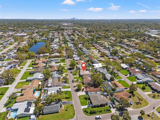 birds eye view of property featuring a residential view and a water view