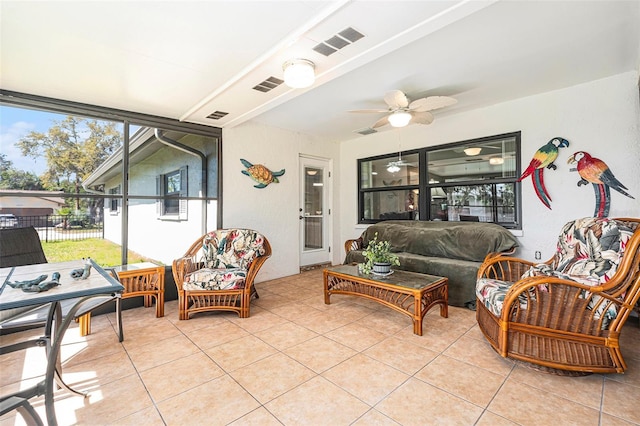 sunroom / solarium with visible vents and ceiling fan