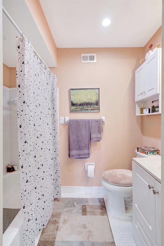 bathroom featuring vanity, visible vents, curtained shower, tile patterned floors, and toilet