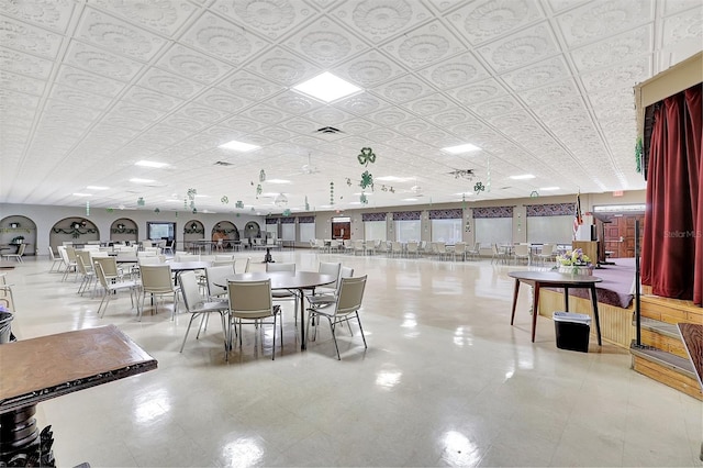 dining space with visible vents and an ornate ceiling