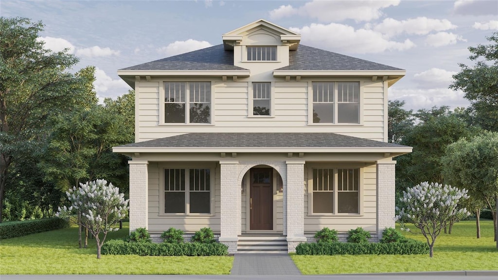 traditional style home featuring brick siding, a front lawn, and roof with shingles