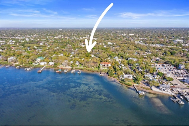 birds eye view of property with a water view