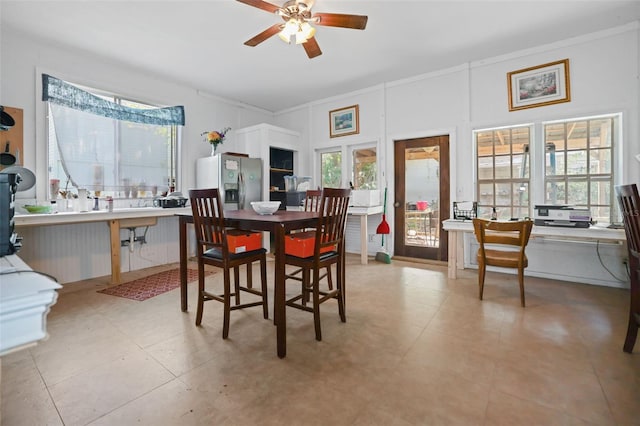 dining space featuring ceiling fan