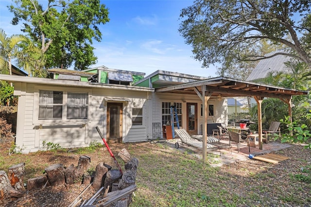 back of house featuring a patio