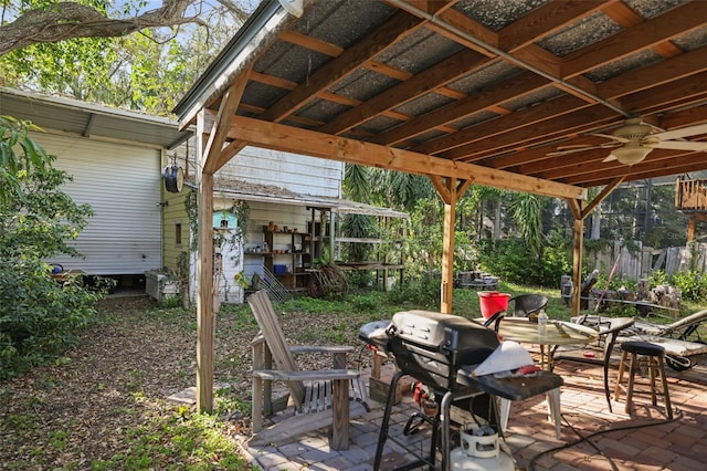 view of patio featuring area for grilling and a ceiling fan