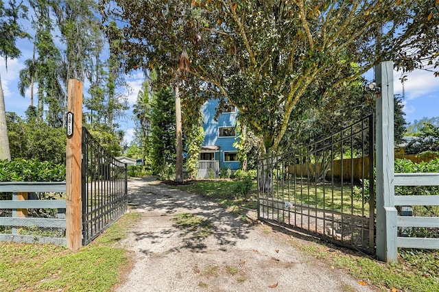 view of gate with fence