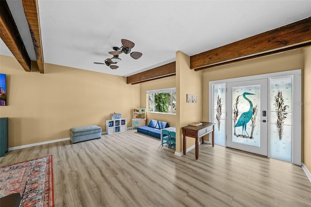 entrance foyer with beamed ceiling, baseboards, and wood finished floors