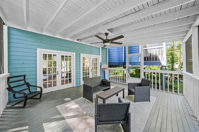 wooden terrace with outdoor lounge area, french doors, and ceiling fan