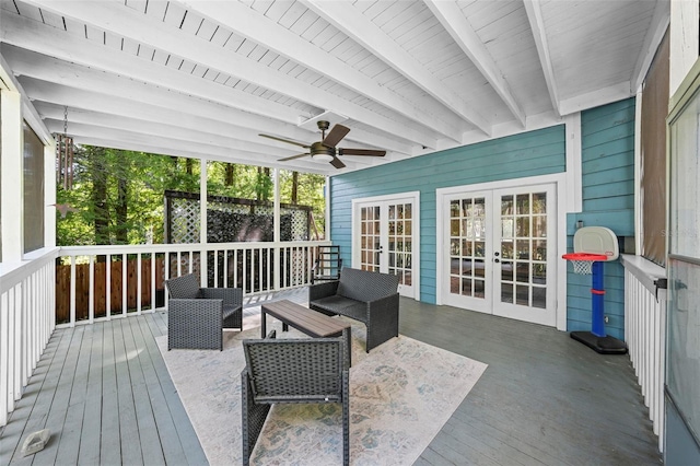 wooden terrace with an outdoor living space, french doors, and a ceiling fan