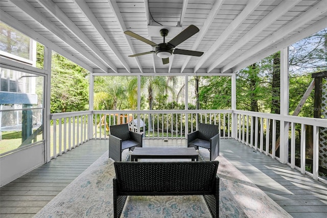 wooden deck featuring a ceiling fan