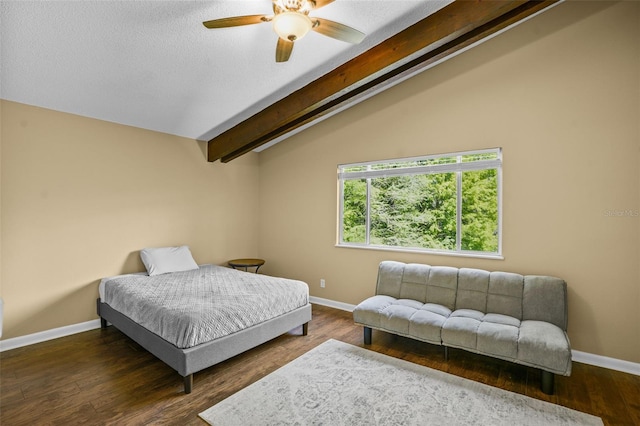 bedroom featuring vaulted ceiling with beams, wood finished floors, baseboards, and a textured ceiling