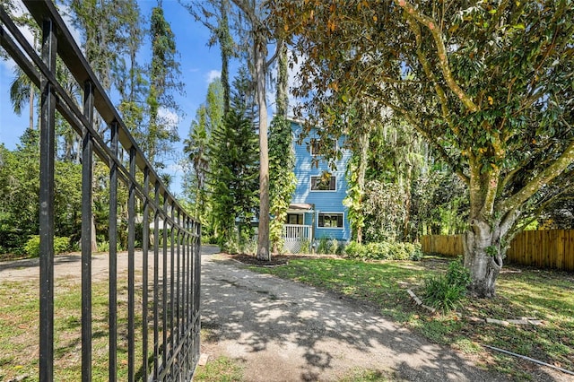 view of front of house featuring fence