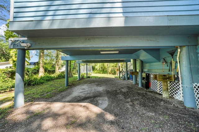 view of vehicle parking with a carport