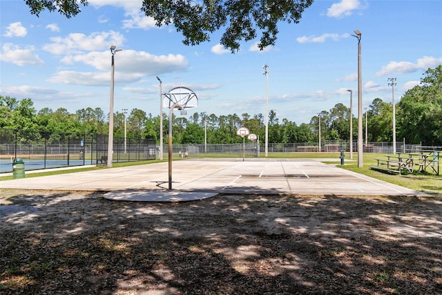 view of sport court with community basketball court and fence