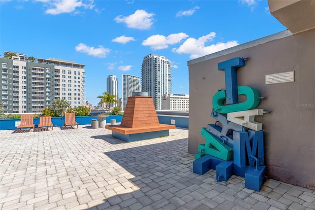 view of patio / terrace featuring a city view