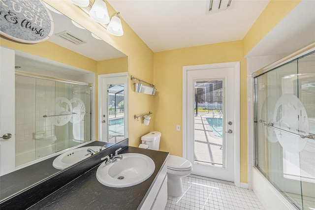 bathroom featuring tile patterned flooring, visible vents, toilet, and vanity