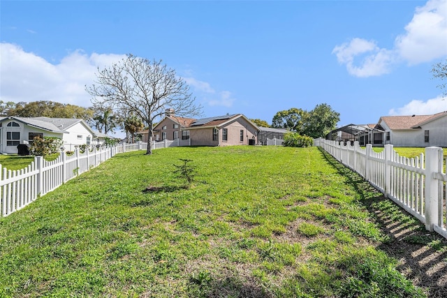 view of yard with a residential view and a fenced backyard