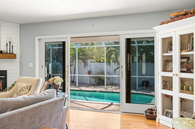 view of pool featuring a large fireplace