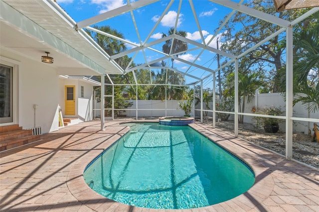 view of pool featuring a patio area, a lanai, and a fenced backyard