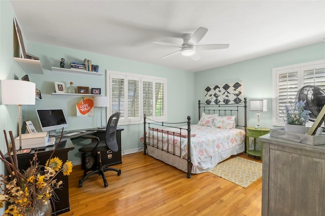 bedroom with ceiling fan and wood finished floors