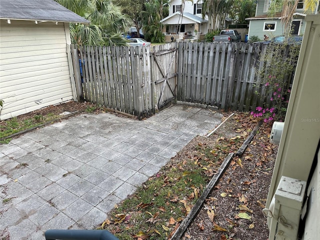 view of patio / terrace featuring a gate and fence