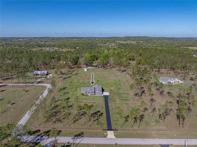 bird's eye view featuring a rural view and a forest view