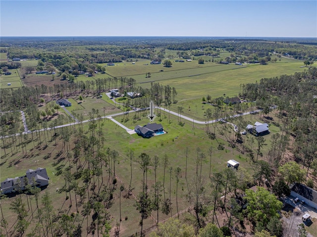 birds eye view of property with a rural view