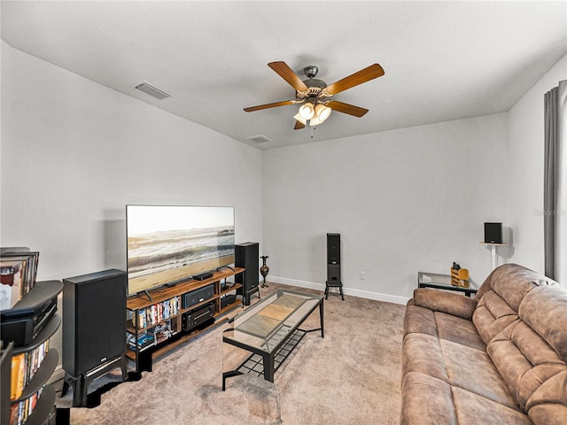 carpeted living area with a ceiling fan, visible vents, and baseboards