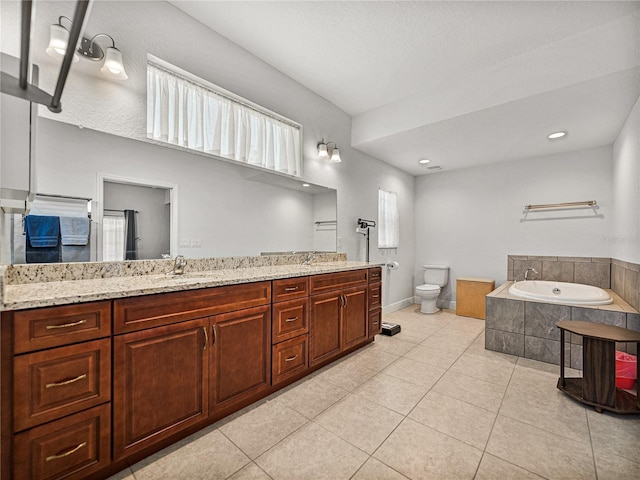 full bathroom with a wealth of natural light, tile patterned floors, toilet, double vanity, and a bath