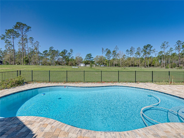 view of pool with a fenced in pool, a yard, and a fenced backyard