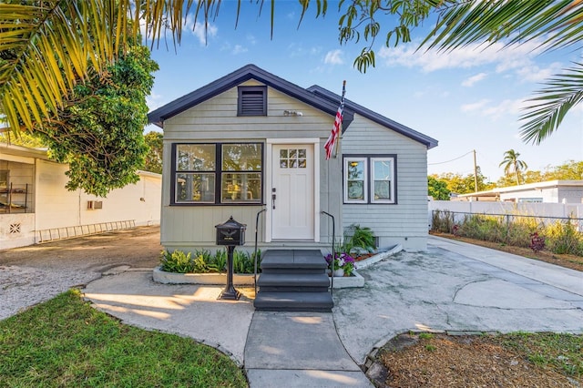 view of front of house featuring fence