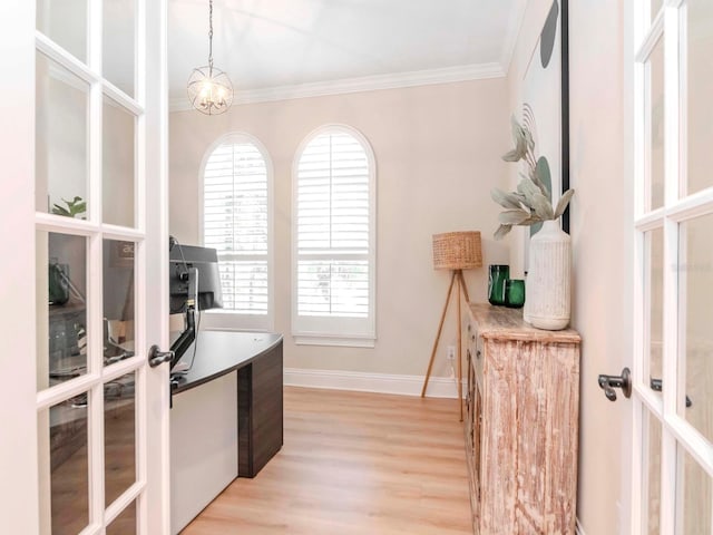 office area with crown molding, french doors, light wood-type flooring, and baseboards