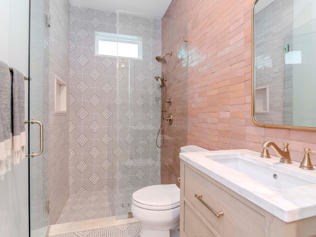 bathroom featuring decorative backsplash, toilet, a walk in shower, and tile walls