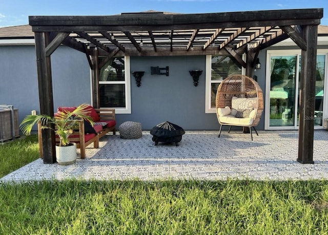 view of patio / terrace with a fire pit and a pergola