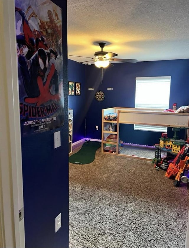 bedroom featuring a textured ceiling, ceiling fan, and carpet flooring