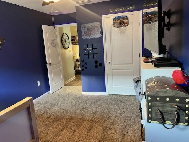 bedroom featuring baseboards and carpet