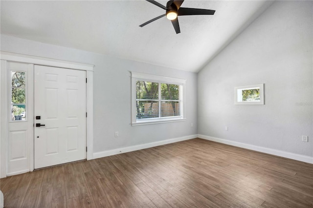 entrance foyer with wood finished floors, a ceiling fan, baseboards, and vaulted ceiling